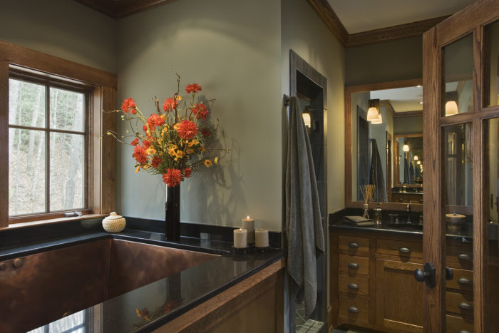 Interior, horizontal, master bathroom copper tub and vanity, Ossman residence, Sylva, North Carolina, M. Shawn Leatherwood & Associates