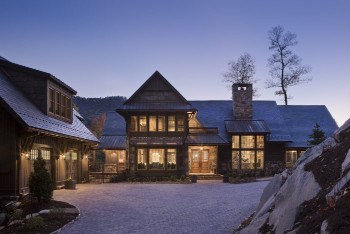 Exterior, horizontal, partial front elevation at twilight, Bowden residence, Balsam Mountain Preserve, North Carolina; M. Shawn Leatherwood & Associates; Morgan Keefe Builders