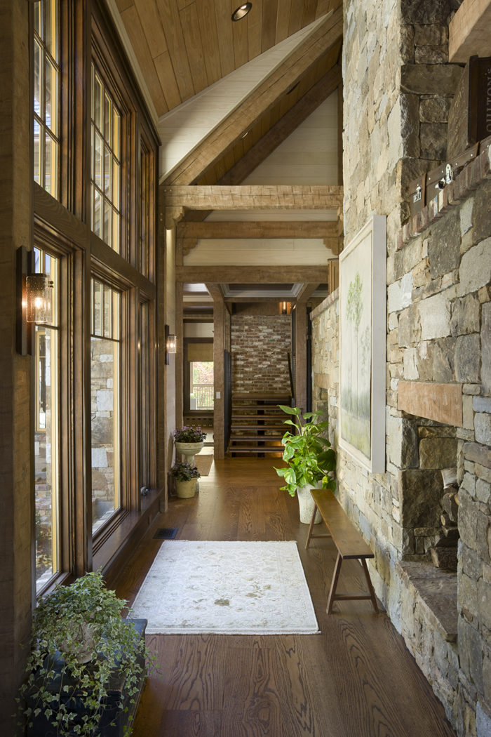 Interior, vertical, hallway toward stairway, Bowden residence, Balsam Mountain Preserve, North Carolina; M. Shawn Leatherwood & Associates; Morgan Keefe Builders