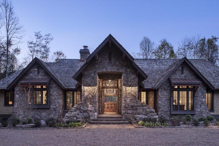 Exterior, horizontal, partial front elevation straight on through entry at twilight, Lemonine residence, Balsam Mountain Preserve, North Carolina; M. Shawn Leatherwood & Associates; Morgan-Keefe Builders