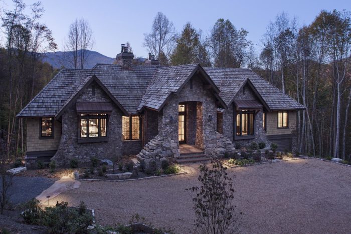 Exterior, horizontal, 3/4 front view at twilight with mountains in the background, Lemonine residence, Balsam Mountain Preserve, North Carolina; M. Shawn Leatherwood & Associates; Morgan-Keefe Builders