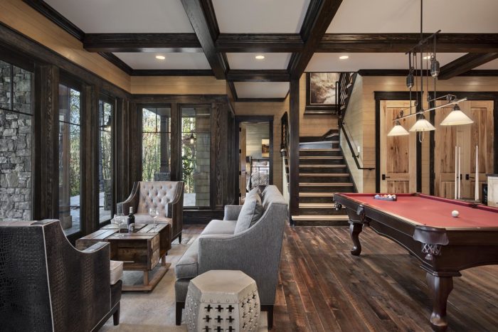 Interior, horizontal, lower level family room toward stairway and guest bedroom, Lemonine residence, Balsam Mountain Preserve, North Carolina; M. Shawn Leatherwood & Associates; Morgan-Keefe Builders
