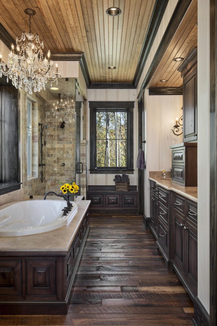 Interior, vertical, master bathroom toward bathtub, shower and vanity, Lemonine residence, Balsam Mountain Preserve, North Carolina; M. Shawn Leatherwood & Associates; Morgan-Keefe Builders