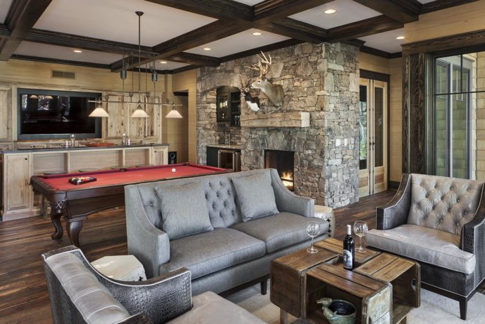 Interior, horizontal, family room toward media center, billiard table, bar, fireplace, wine cellar and sitting area, Lemonine residence, Balsam Mountain Preserve, North Carolina; M. Shawn Leatherwood & Associates; Morgan-Keefe Builders
